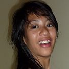 Exploited Thai teen girl smiling for a sexy snapshot in Chon Buri