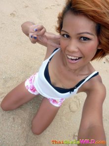 Pattaya beach girl strips in sand and shower