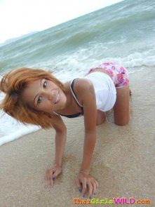 Pattaya beach girl strips in sand and shower
